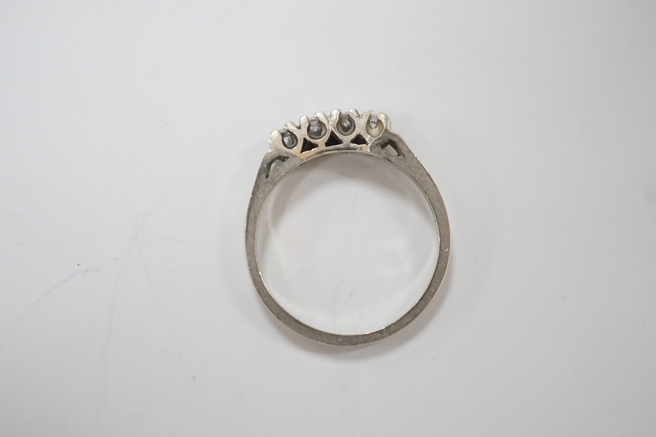 A Canadian Birks 18k white metal and four stone diamond set ring, size I, gross weight 1.8 grams.